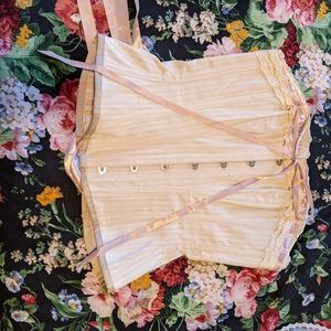 Corset story cream with pink ribbon corset